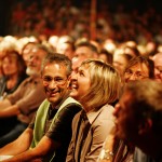 Audience watching a show in a small theatre